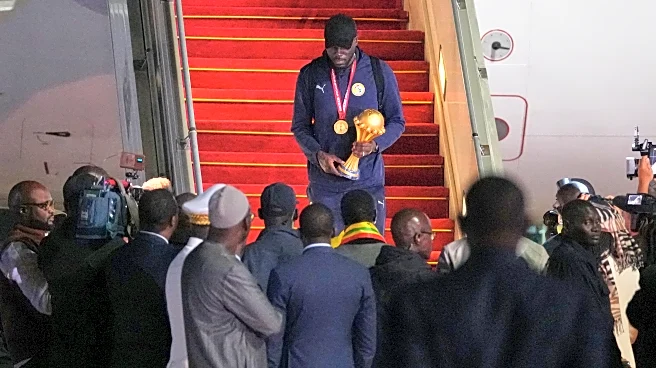 Senegal President greets team as triumphant players receive heroes welcome in Dakar