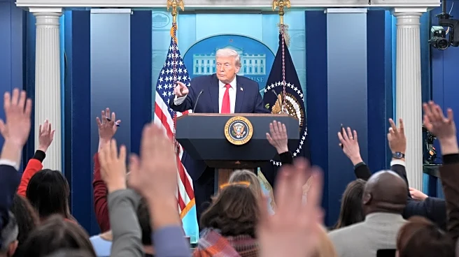 Trump recaps his first year back in office with winding remarks, paper tossing and impressions