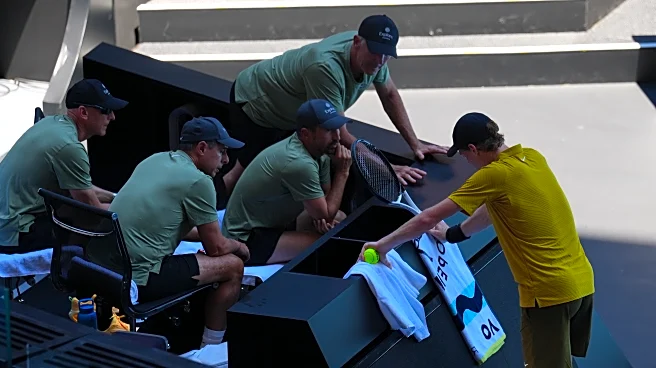 Sinner overcomes cramps, heat to continue his title defense at the Australian Open