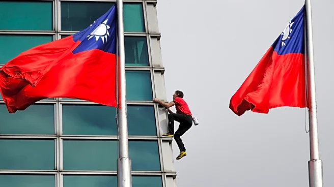 American rock climber Alex Honnold climbs Taipei 101 skyscraper without ropes