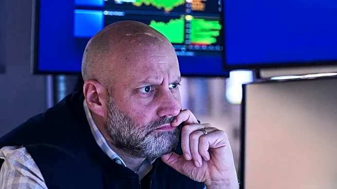 Stocks zigzag on Wall Street following mixed profit reports from UnitedHealth, GM and others