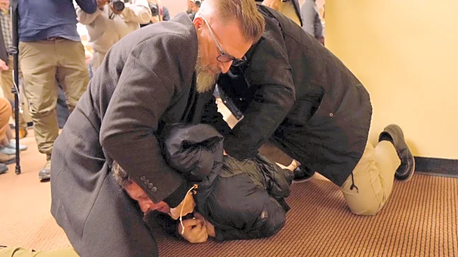 Man sprays unknown substance on Rep. Ilhan Omar and is tackled at Minneapolis town hall