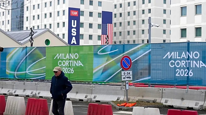 Athletes bring Milan Olympic Village to life, complete with Italian bidets and 4-story US banners