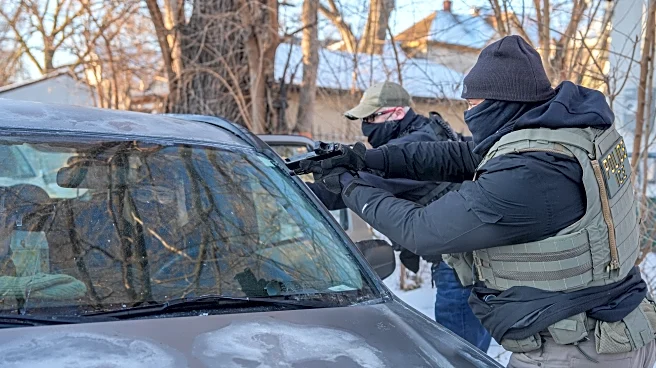 Immigration agents draw guns, arrest activists following them in Minneapolis