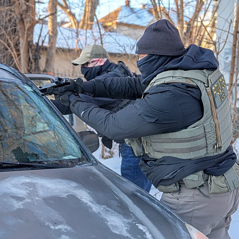 Immigration agents draw guns and arrest activists following them in Minneapolis