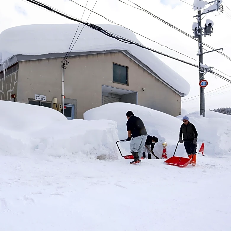 Heavy snow in northern Japan blocks roads and causes dozens of deaths