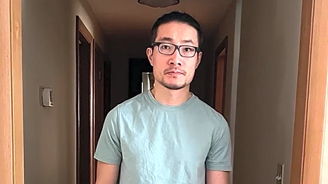 Chinese national who exposed rights abuses is freed from US detention after being granted asylum