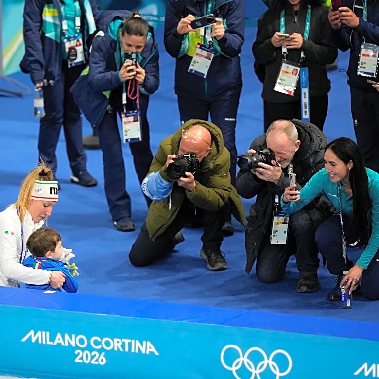 Francesca Lollobrigida hugs her son after winning Italy's first gold of the Milan Olympics