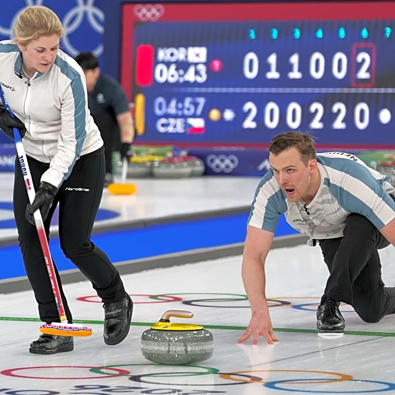 On the ice, these curlers are scowling at each other. Off the ice, they're happily married