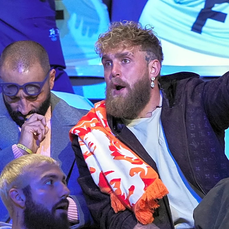Jake Paul sits in the second row to watch his fiancée, Jutta Leerdam, in Olympic speedskating