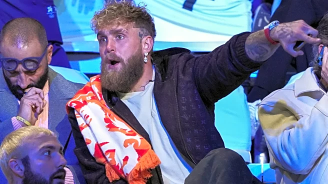 Jake Paul sits in the second row to watch his fiancée, Jutta Leerdam, in Olympic speedskating