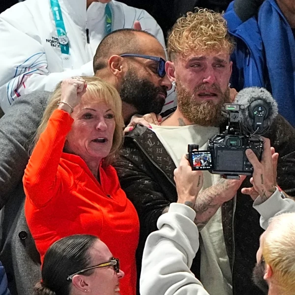 Jake Paul cheers from the second row as his fiancée, Jutta Leerdam, wins Olympic speedskating gold