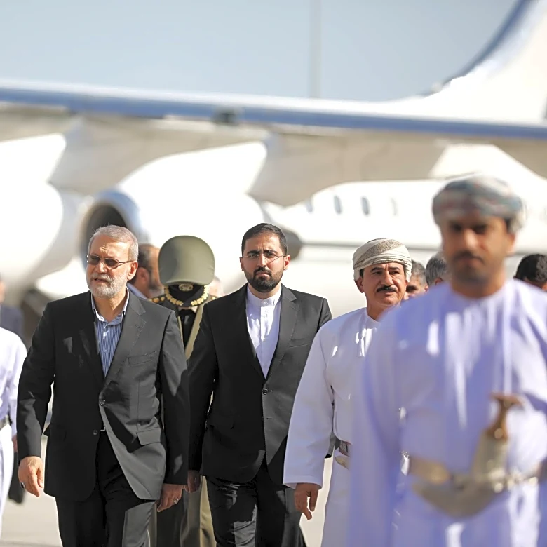 Top Iran security official is in Oman, site of talks with the US, likely with a nuclear message