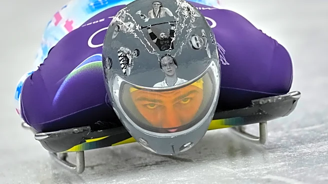 Ukrainian trains in helmet honoring fellow athletes killed in war. IOC says it's banned for race
