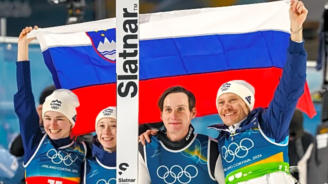 Slovenian siblings Domen and Nika Prevc win Olympic gold in ski jumping team event
