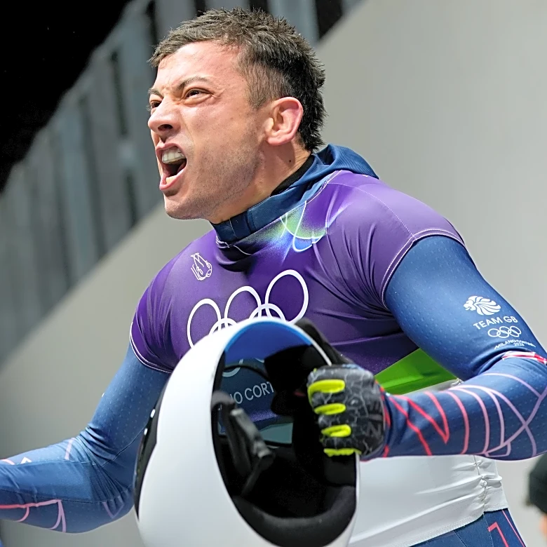 Weston gets his 1st Olympic skeleton gold medal, in race where Heraskevych was DQ'ed before start