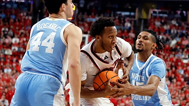 NC State rolls past 16th-ranked and injury-depleted rival North Carolina 82-58