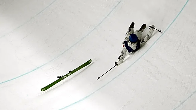 Defending Olympic champion Eileen Gu falls in her first run of freeski halfpipe qualifying