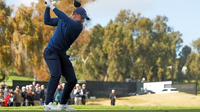 Rory McIlroy handles the rain and then wind to share clubhouse lead at Riviera