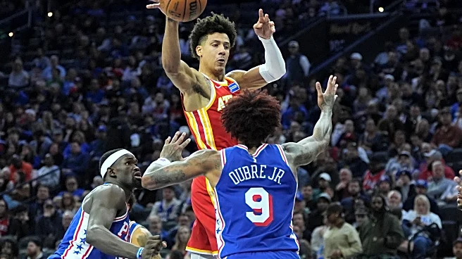 Johnson and McCollum power Hawks past the 76ers 117-107 as Atlanta snaps 3-game skid