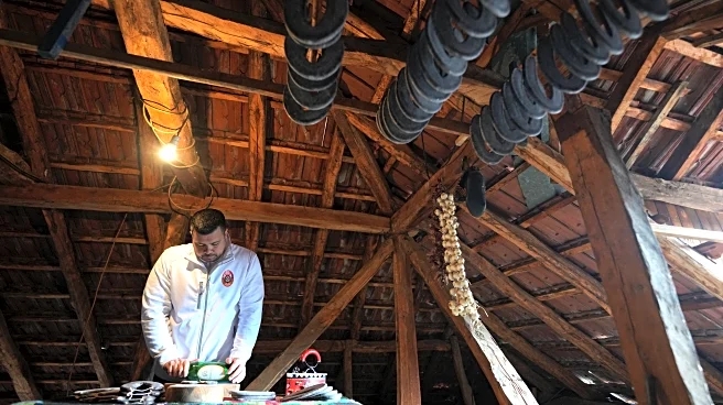 A traditional sausage in the shape of a horseshoe is 'ironed' for dryness in southeastern Serbia