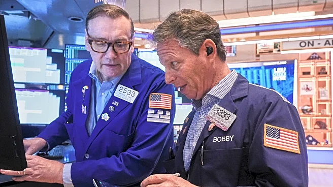 US stocks edge lower after reports show both slowing growth and higher inflation
