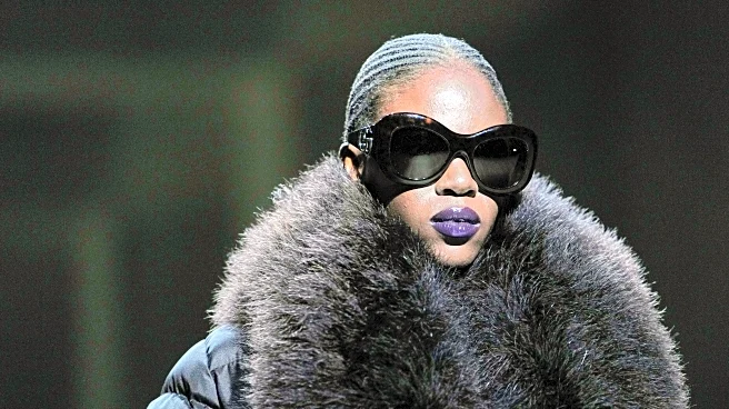 Kate Moss closes Demna's first Gucci show in a plunging gown and branded thong