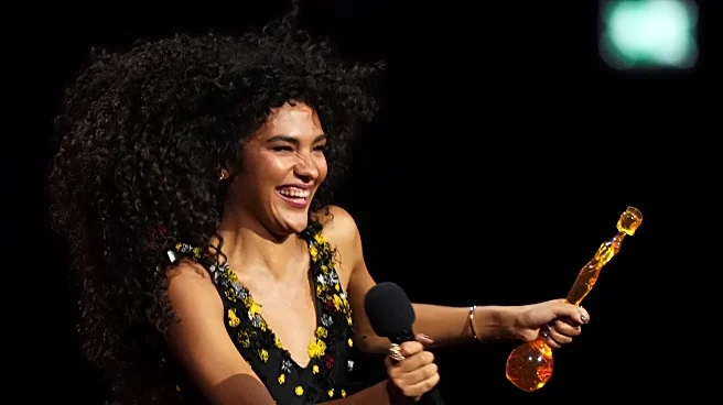 Olivia Dean wins 4 Brit Awards, taking artist of the year and song of the year