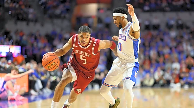 No. 7 Florida clinches at least a share of the SEC title with a 111-77 drubbing No. 20 Arkansas