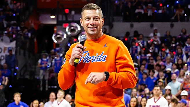 Florida coach Jon Sumrall's photoshoot with a 7-foot alligator includes some tense moments