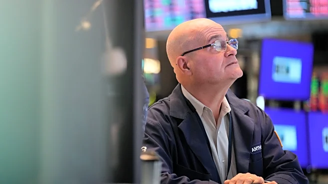 Wall Street holds steadier as oil prices stop spiking, for now at least