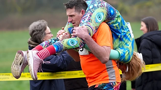 Finnish pair wins a barrel of ale in annual 'wife-carrying' contest in England