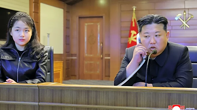 North Korean leader Kim and his daughter try out new pistols at shooting range