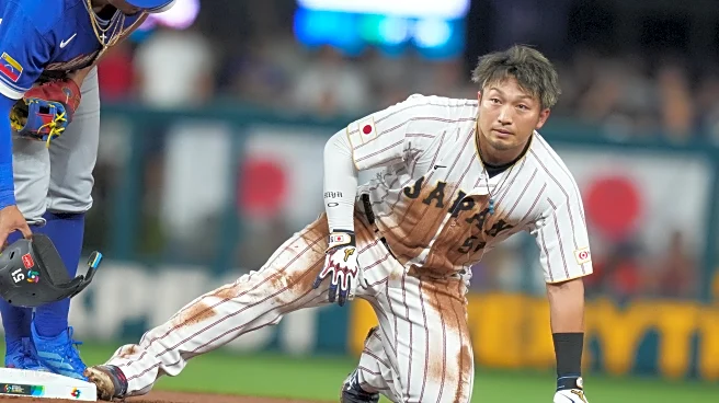 Japan's Seiya Suzuki leaves WBC quarterfinal after appearing to hurt leg on slide