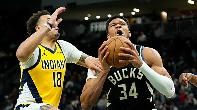 Giannis Antetokounmpo leaves Bucks' victory over Pacers after landing awkwardly on dunk