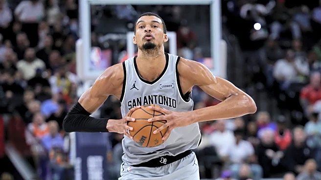 Wembanyama powers Spurs past Clippers 119-115 after wild swings and a late scare to reach 50 wins