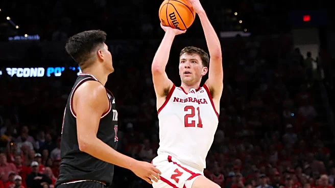 Nebraska gets its first NCAA Tournament win, beating Troy 76-47 behind Pryce Sandfort's 23 points