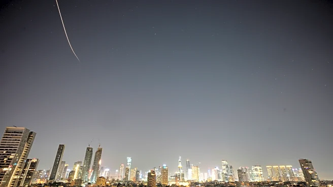 Iran targets Israel and Gulf Arab states even as Trump says US is in talks to end the war