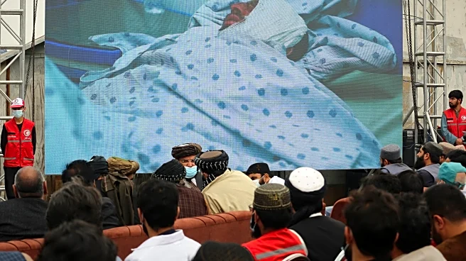 Afghans hold second mass funeral for victims of an airstrike that hit a Kabul drug treatment center