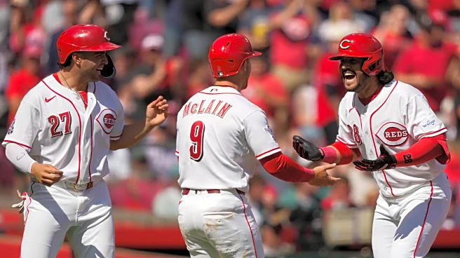 Eugenio Suarez hits a 3-run homer and Reds beat Red Sox 3-2 to win season-opening series