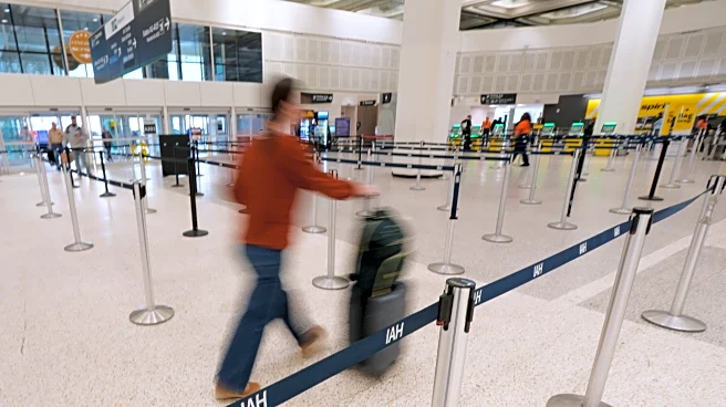 Airport bottlenecks ease as TSA workers get paid, but shutdown continues