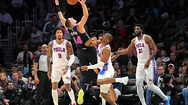 Heat rally late, use 14-0 run in final moments to pull away and beat 76ers 119-109