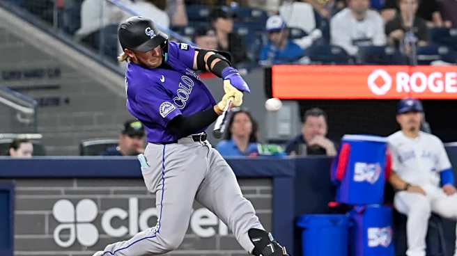 Johnston hits a 2-run homer as the Rockies rout the Blue Jays 14-5 for their 1st win of the season