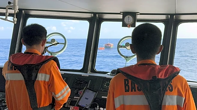 Rescuers try to find 27 people believed to be on raft drifting in Indonesian waters