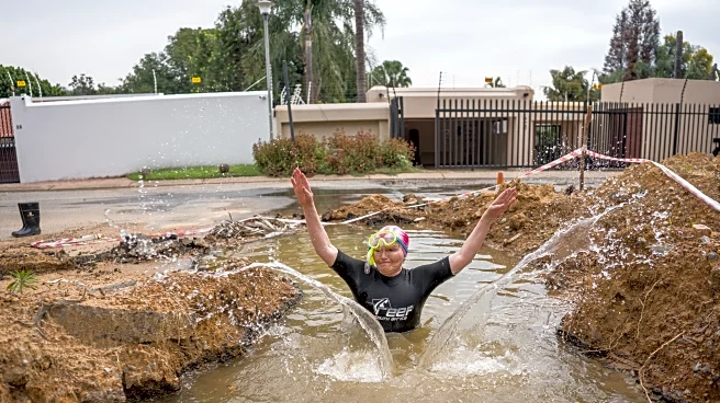A South African politician goes snorkeling in a giant pothole to highlight city management failures
