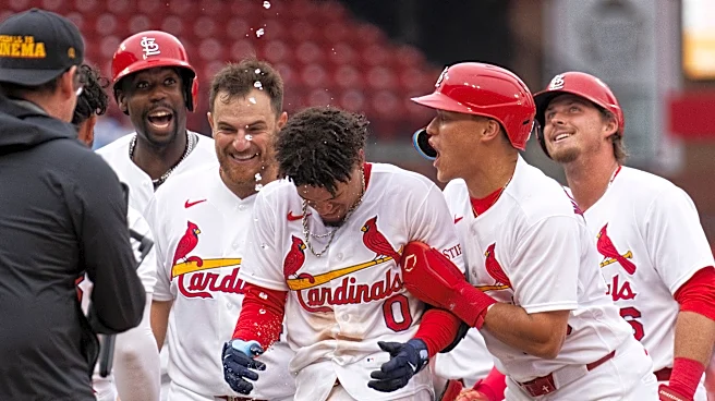 Winn's bloop single lifts Cardinals to 2-1 victory over slumping Mets in 11 innings