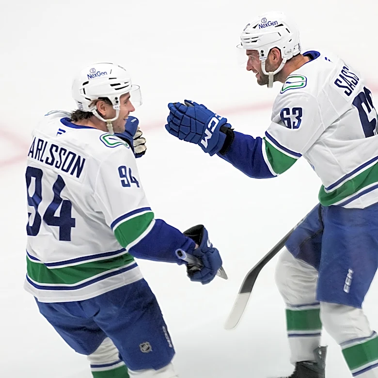 Boeser has hat trick, last-place Canucks overcomes blowing 4-goal lead to beat NHL-leading Avs 8-6