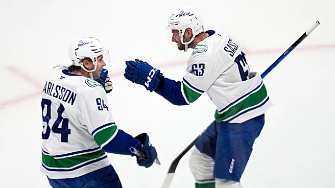 Boeser has hat trick, last-place Canucks overcomes blowing 4-goal lead to beat NHL-leading Avs 8-6