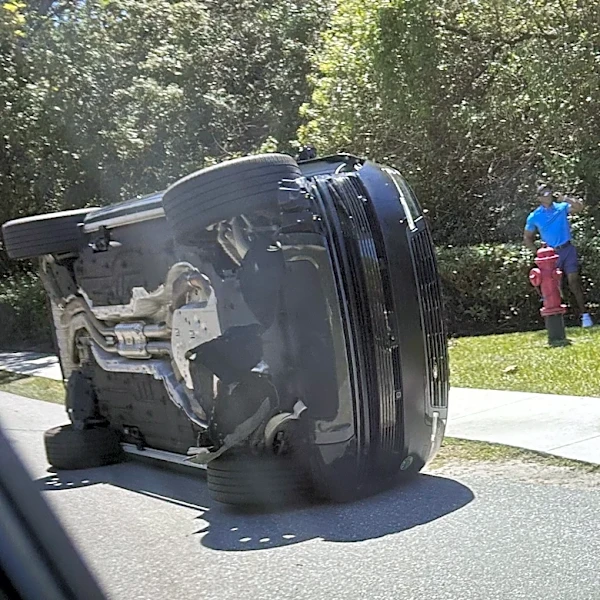 Bodycam shows a stunned Tiger Woods handcuffed after a Florida rollover crash