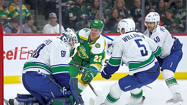 Wild wrap up a playoff spot with 5-2 victory over the Canucks